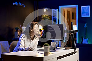 Woman deploying programming script increasing data security on desktop PC photo