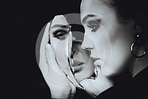 Woman with depression mirror, black and white portrait photo