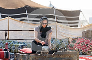 Woman in a desert camp near Doha