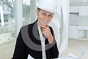 Woman designer looking at house interior