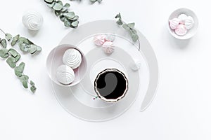 Woman desk with plant, coffee and marsh-mallow in spring desing on white background flat lay mock-up