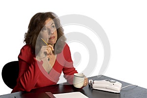 Woman at desk thinking