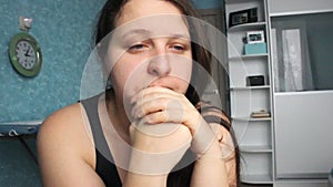 Woman desperate at home. Victim of Abuse Violence. Caucasian girl with long brown hair crying in her room with blue and white. Fat