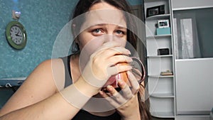 Woman desperate at home. Victim of abuse violence. Caucasian girl with long brown hair crying in her room with blue and white. Fat