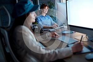 woman devoted to her career working overtime on computer in office.