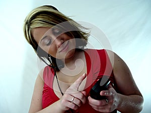 Woman dialing on telephone