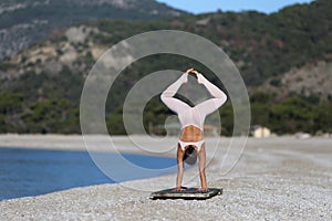 Woman in diamond handstand