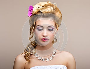 Wedding. Beautiful Thinking Bride with Diamond Necklace. Elegance & Femininity photo