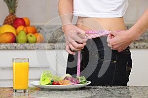 Woman on diet eating salad photo