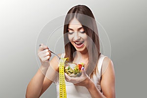 Woman. Diet. Portrait. Womens model with green salad. Adherence