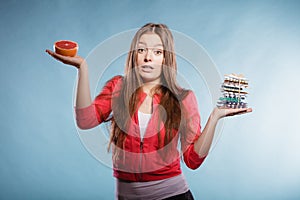 Woman with diet weight loss pills and grapefruit.