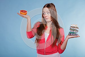 Woman with diet weight loss pills and grapefruit.