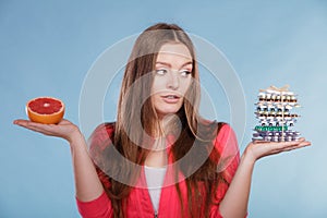 Woman with diet weight loss pills and grapefruit.