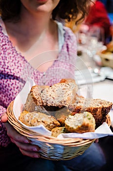 Woman with different types of bread