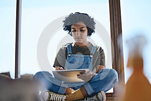 Woman, digital tablet and graphic design in studio for creative art brand, online shopping website or e commerce logo