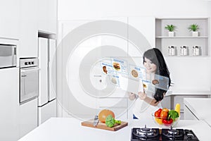 Woman and digital tablet with virtual recipes