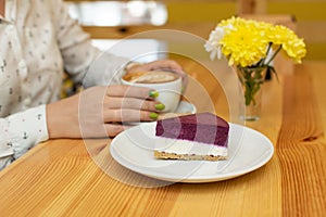 Woman dinner with cheessecake and coffee at restaurant
