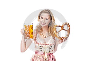 Woman with dirndl and beer and bretzel