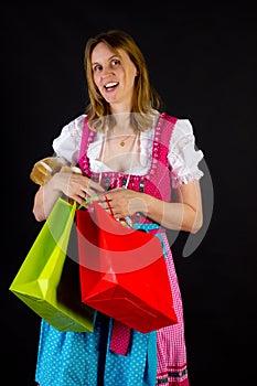 Woman in dirndl on shopping tour