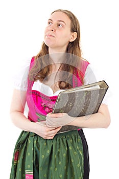 Woman in dirndl thinking about her success in business
