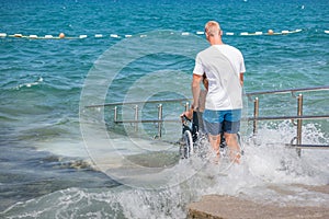 Woman with disability on wheelchair at beach