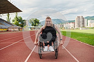 A woman with disablity driving a wheelchair on a track while preparing for the Paralympic Games