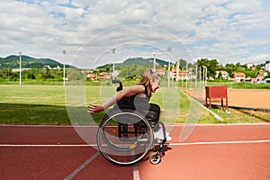 A woman with disablity driving a wheelchair on a track while preparing for the Paralympic Games