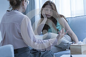 Woman discussing problems with counselor