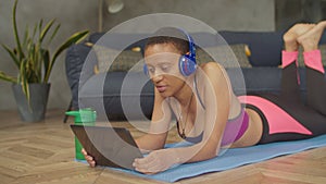 Woman discussing training with fitness instructor online