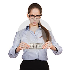Woman with disdain holding hundred dollar bill photo