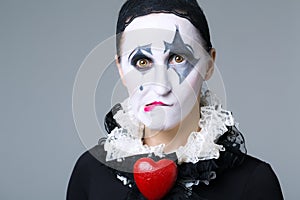 Woman in disguise harlequin photo