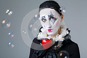 Woman in disguise harlequin photo