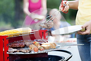 Woman dishing out tasty chuck steak