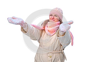 A woman with a displeased sad face stands by the snowy s in the wint