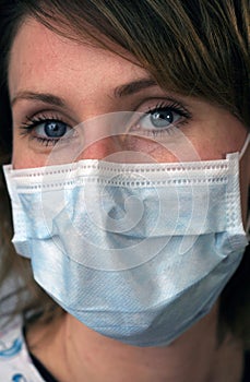 Pretty Woman with Disposable Face Mask photo