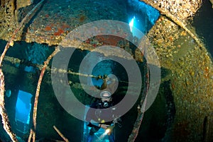 Woman diver on ship wreck