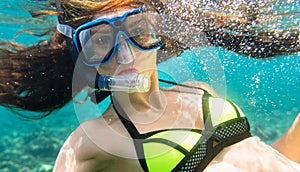 Woman diving or snorkelling in ocean