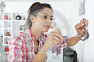 woman during diy hook wall