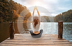 Woman do yoga outdoor. Woman exercising yoga