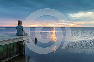 Woman on Dock Watching Sunset in NC