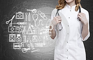 Woman doctor and blackboard with medicine sketches