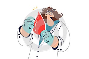 Woman doctor calls to become donor and holds large drop blood, working in laboratory analyzing DNA