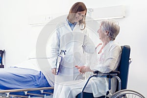 Woman doctor consulting with a senior patient