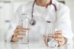Woman doctor with drinking water