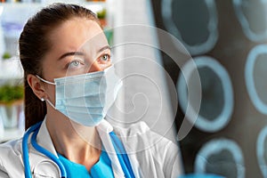 Woman doctor examines head mri scan in hospital