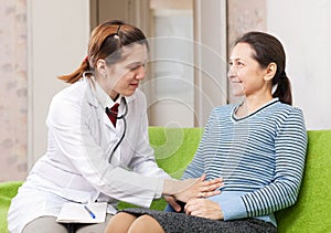 Woman doctor examining the patient in clinic
