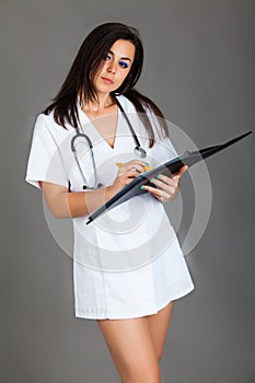 Woman doctor on grey background medical staff personell nurse