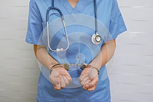 Woman doctor handcuffed. Bribe