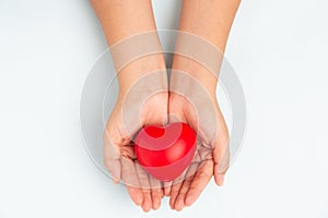Woman doctor hands holding red heart on wide blue background donate for foundation hospital blood care concept Panoramic world