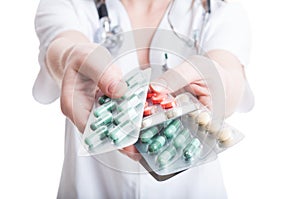 Woman doctor hands offering tablets or blisters